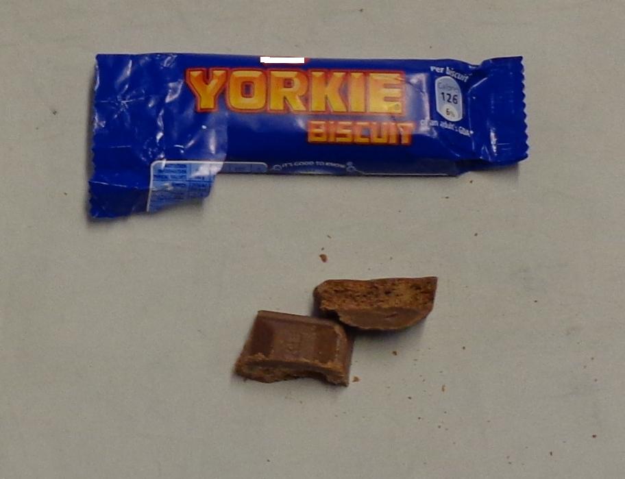 A MILK CHOCOLATE BAR. ALSO CONTAINING FLOUR SEMOLINA WHEAT, OIL PALM, WHITE SUGAR, WATER, WHOLE OAT FLOUR, NATURAL COCOA POWDER, INVERT LIQUID SUGAR, LIQUID MALT, AMMONIUM BICARBONATE, SODIUM BICARBONATE POWDER, NATURAL VANILLA FLAVOUR. IT IS DIVIDED INTO THREE CHUNKS EACH OF WHICH CAN BE BROKEN OFF AND EATEN SEPARATELY. THERE IS A CRUNCHY INNER FILLING. WEIGHT 24.9 GRAMMES. CONTAINED IN A WRAPPER. PUT UP FOR RETAIL SALE.