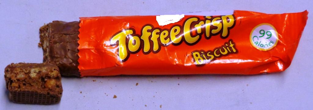 A MILK CHOCOLATE BAR. ALSO CONTAINING LOW BLEND VEGETABLE OIL, GLUCOSE SYRUP, WHITE SUGAR, WHEAT CEREAL SPHERES, RICE, CONDENSED SWEETENED SKIMMED MILK, WHEY PERMEATE POWDER, COCOA POWDER, WATER, SALT, NATURAL VANILLA FLAVOUR, SUNFLOWER LIQUID. WEIGHT 19 GRAMMES. CONTAINED IN A WRAPPER. PUT UP FOR RETAIL SALE.