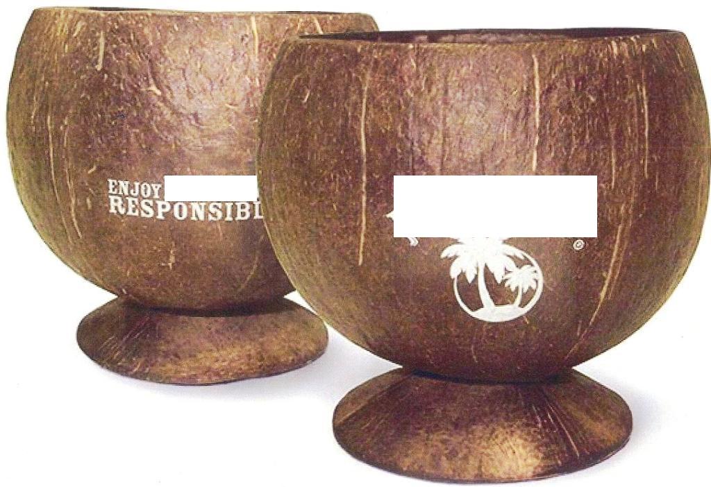 NATURAL COCONUT SHELL CUP. MADE OF A SINGLE COCONUT - CUT INTO TWO PIECES LARGER ONE IS USED TO HOLD LIQUID AND SMALLER ONE USED AS BASE. COATED ON THE INSIDE WITH FOOD GRADE GLUE. POLISHED AND PRINTED IN WHITE WITH POPULAR ALCOHOLIC RUM BASED DRINK LOGO AND SLOGAN. PACKAGED IN A POLYBAG