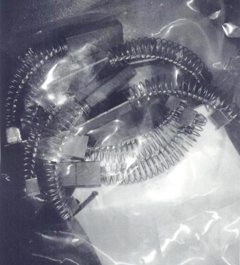 DEVICE IS A CARBON BRUSH MADE OF CARBON AND STEEL. DEVICE IS USED FOR CONTACT IN AN ELECTRICAL MOTOR. THE DEVICE IS PART OF A HIGH PRESSURE DIE CASTING MACHINE. THE DEVICE IS NOT A MACHINE SPECIFIC PART.