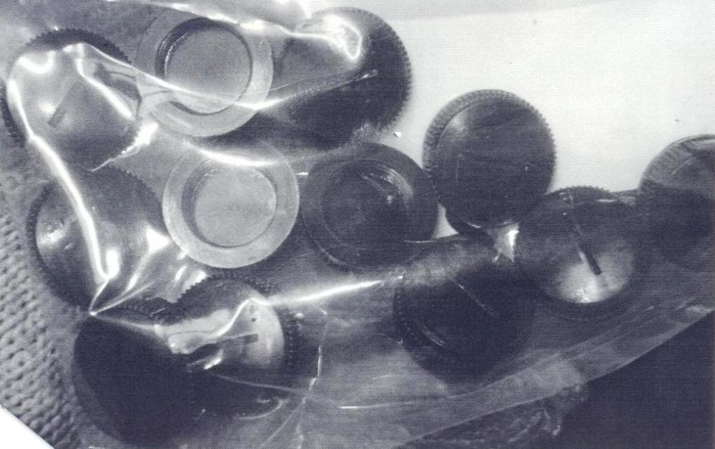 A PLASTIC MOTOR BRUSH CAP TO SECURE BRUSHES IN AN ELECTRICAL D/C MOTOR. 

SPECIFICALLY FOR USE ON A HIGH PRESSURE DIE CASTING MACHINE,