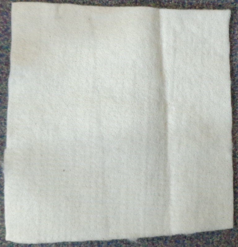 A NON-WOVEN WADDING FABRIC MADE OF WOOL, VISCOSE AND POLYPROPYLENE. IT IS CREATED FROM THREE LAYERS WHICH ARE NEEDLE PUNCHED TOGETHER, AND THEN COMPRESSED TO FORM THE FINISHED PRODUCT. THE FIBRES CAN BE PULLED APART QUITE EASILY, AND THE FABRIC IS ABOUT FIVE MILLIMETRES THICK. TO BE USED AS AN INTERLINER AND IN THE FURNITURE INDUSTRY.