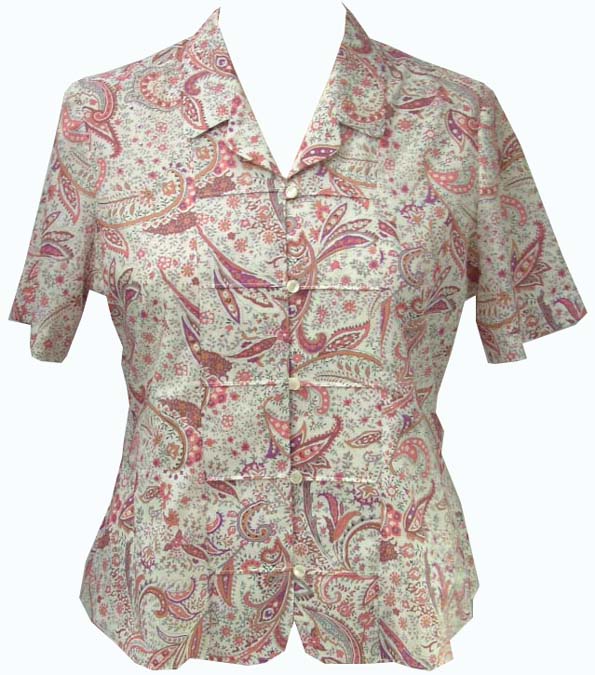 WOVEN BLOUSE FOR WOMEN.  REACHING DOWN TO BELOW THE WAIST.  V-NECK WITH COLLAR.  COMPLETE FRONT OPENING FASTENED RIGHT OVER LEFT BY BUTTONS.  SHORT SLEEVES.  HEMMED AT BASE.  SELF FABRIC BACKNOTED BELT.  100 PER CENT COTTON