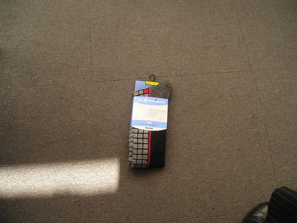 A PAIR OF KNITTED SOCKS. OF 28 PERCENT POLYAMIDE, 26 PERCENT ACRYLIC, 24 PERCENT WOOL, 12 PERCENT COTTON, 9 PERCENT POLYESTER AND 1 PERCENT OF ELASTANE LYCRA. PACKAGED IN A CARDBOARD SLEEVE.