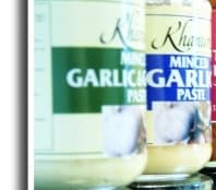 MINCED  GARLIC PASTE PACKAGED FOR RETAIL SALE IN A  210 GRAM GLASS BOTTLE.  INGREDIENTS INCLUDE MINCED GARLIC. 85% , WATER, RAPE SEED OIL, SUGAR, SALT, ACETIC ACID 2%  , CITRIC ACID. USED IN COOKING.