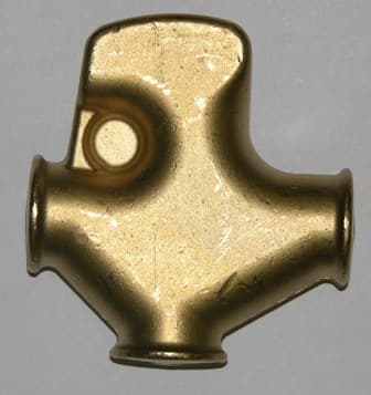 A STAMPED BRASS RADIATOR FILLER BODY. THIS IS PART OF A WATER DISPENSING MACHINE FOUND ON PETROL STATION FORECOURTS FOR FILLING CAR RADIATORS. IT IS DESIGNED TO HAVE VALVES, LEVERS AND MECHANISMS INCORPORATED INTO IT. MEASURES APPROX 70MM X 65MM X 20MM.