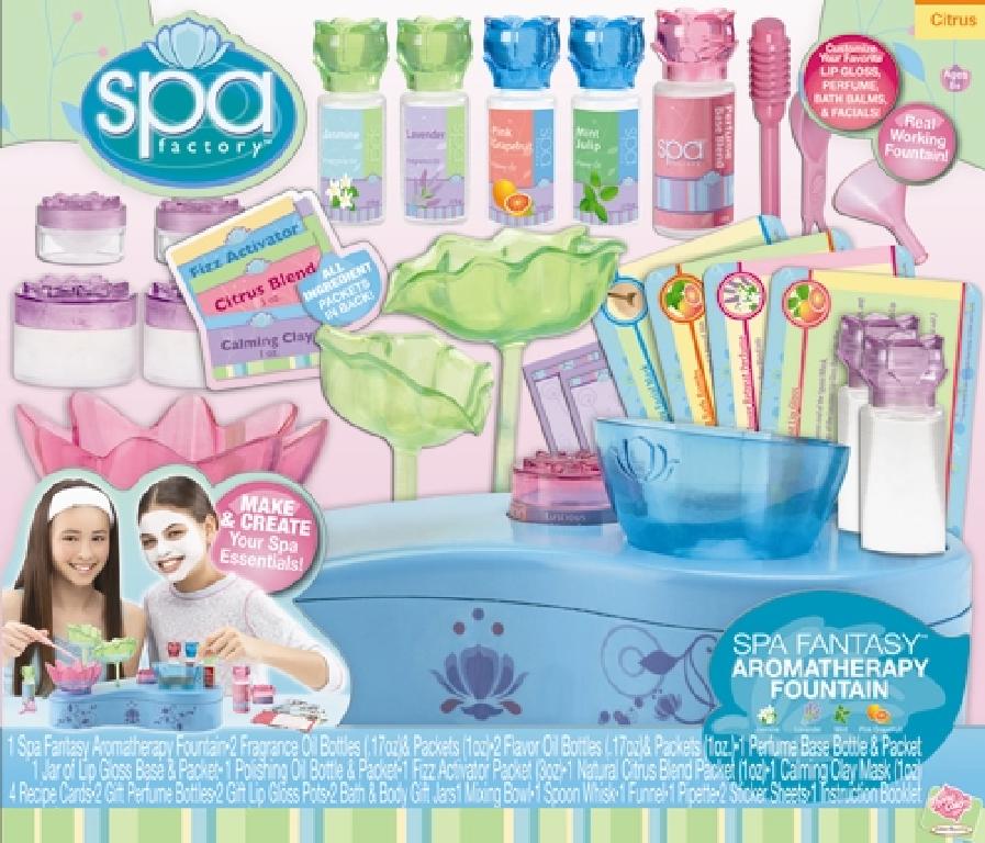 A CHILDS BEAUTY SET TO MAKE LIP GLOSS, PERFUME, BATH SALTS AND FACIAL MASKS. PACKAGED TOGETHER FOR RETAIL SALE WITH A PLASTIC WATER FOUNTAIN WHICH HAS A BATTERY POWERED MOTOR. WHEN WATER IS PUMPED THROUGH IT THE CHILD ADDS THE OILS TO THE FOUNTAIN TO MAKE IT PRODUCE AN AROMA. THE SETS CONSISTS OF A MIXING BOWL, ESSENTIAL OIL BOTTLES, FRAGRANCE, FIZZ ACTIVATOR, NATURAL CITRUS BLEND, CALMING CLAY MASK, FLAVOUR OIL, PERFUME AND LIP GLOSS PACKETS, PERFUME GIFT BOTTLES, LIP GLOSS AND BODY BATH JARS, SPOON WHISK, FUNNEL, STICKER LABELS, PIPETTE AND AN INSTRUCTION BOOKLET. PACKAGED IN AN OPEN WINDOW CARDBOARD BOX.