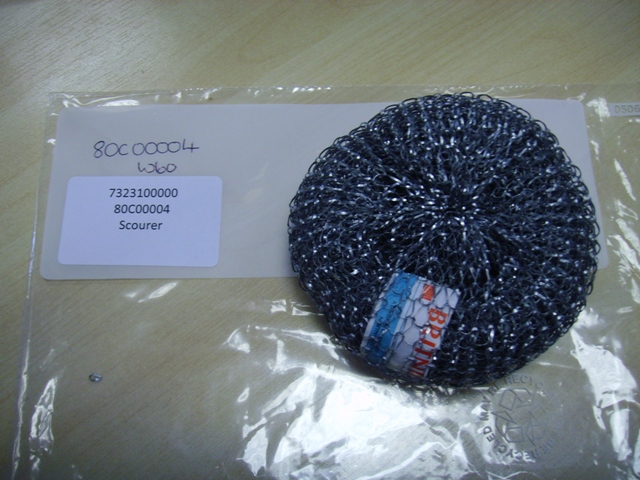 A PAN SCOURING PAD OF GALVANISED STEEL WOOL.