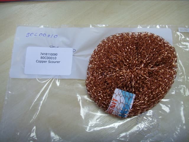A POT SCOURER OF COPPER.