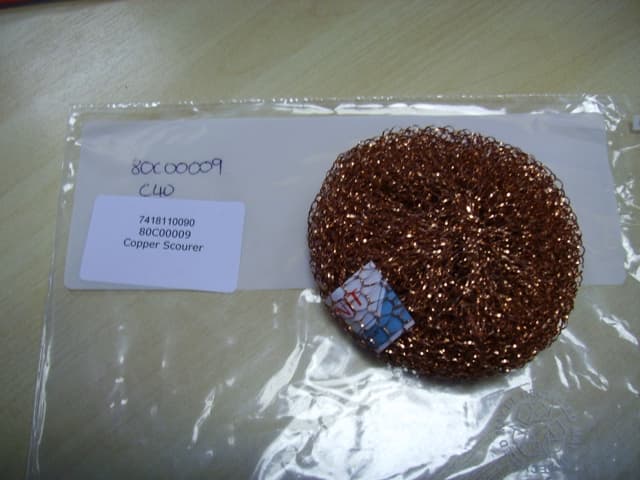 A POT SCOURER OF COPPER.