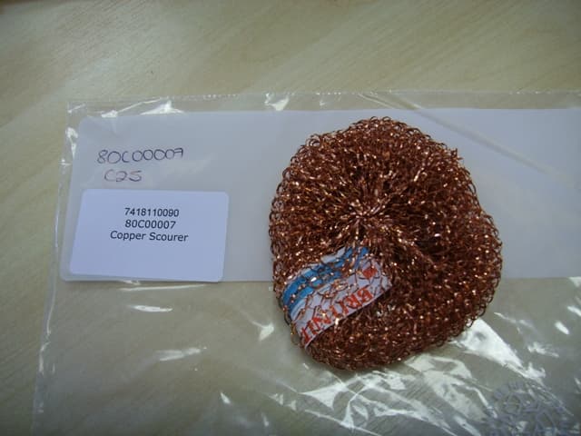 A POT SCOURER OF COPPER.