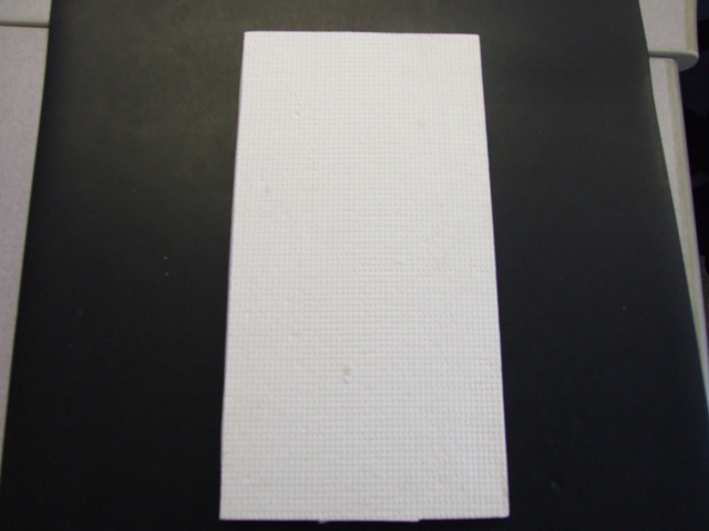 MINERAL WOOL IN SHEET FORM, USED AS A CATALYTIC CONVERTER WRAP. COMPRISING OF ALUMINA (111) OXIDE 86.4 - 88.2  PER CENT, SILICA 2.7 - 4.5 PER CENT, ORGANIC BINDER 10 PER CENT