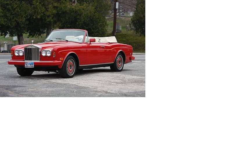 1986 ROLLS ROYCE CORNICHE II CONVERTIBLE. 4 DOOR. RED IN COLOUR. 6750CC V-8 ENGINE. A USED VEHICLE WITH A SPARK IGNITION INTERNAL COMBUSTION RECIPROCATING PISTON ENGINE.