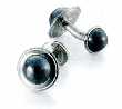 PAIR OF CUFFLINKS. OF STAINLESS STEEL. ROUND, DECORATED WITH SEMI-PRECIOUS STONE HEMATITE AT EACH END.  PACKED IN A CARDBOARD AND PAPER GIFT BOX.
