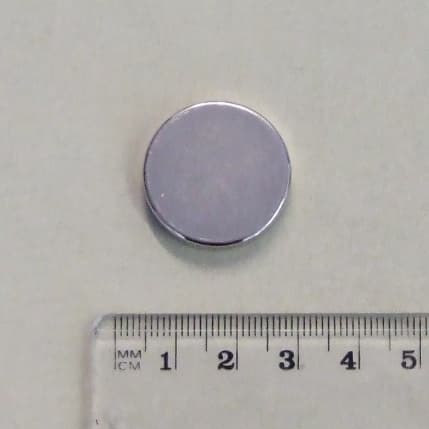 NEODYMIUM MAGNET DISCS USED IN THE MANUFACTURE OF LOUDSPEAKERS FOR THE AUTOMOTIVE INDUSTRY.  A SMALL CIRCULAR DISC OF SILVER COLOURED METAL MADE OF AN ALLOY OF NEODYMIUM, IRON AND BORON.  DIMENSIONS: 25 (DIAMETER) X 4 MM.