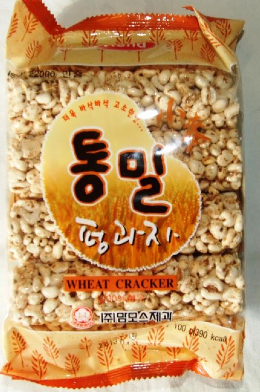 WHEAT CRACKER. MADE FROM SWOLLEN GRAINS OF WHEAT. INGREDIENTS: WHEAT, SUGAR, CORN SYRUP, GELATIN AND MARGARINE. PRODUCTS IS CYLINDRICAL SHAPED. APPROX 12CM IN LENGTH, 3.5CM WIDTH. PACKAGED IN A PRINTED AIR TIGHT BAG 100G.