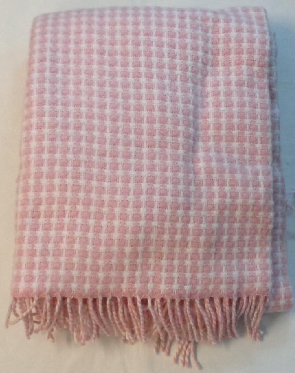 100% WOOL WOVEN THROW. MEASURES APPROXIMATELY 130CM X 170CM. WITH TASSEL DECORATION. PRESENTED IN A CLEAR PLASTIC BAG WITH CARRY HANDLES.