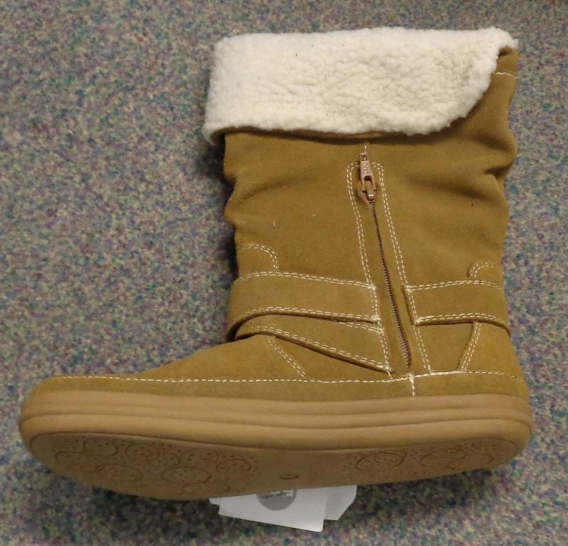 A LADIES BOOT WITH A 100% SUEDE LEATHER UPPER, AND A THERMO PLASTIC RUBBER SOLE. IT COVERS THE ANKLE AND THE LOWER PART OF THE CALF. IT HAS ONE BUCKLE GOING ROUND THE LOWER PART OF THE ANKLE, AND A VERTICAL ZIP OPENING ON THE INNER SIDE. THE TOP FOLDS OVER WITH A SHEEPSKIN TRIM. COMES IN VARIOUS SIZES. LIGHT BROWN IN COLOUR, WITH WHITE STITCHING.