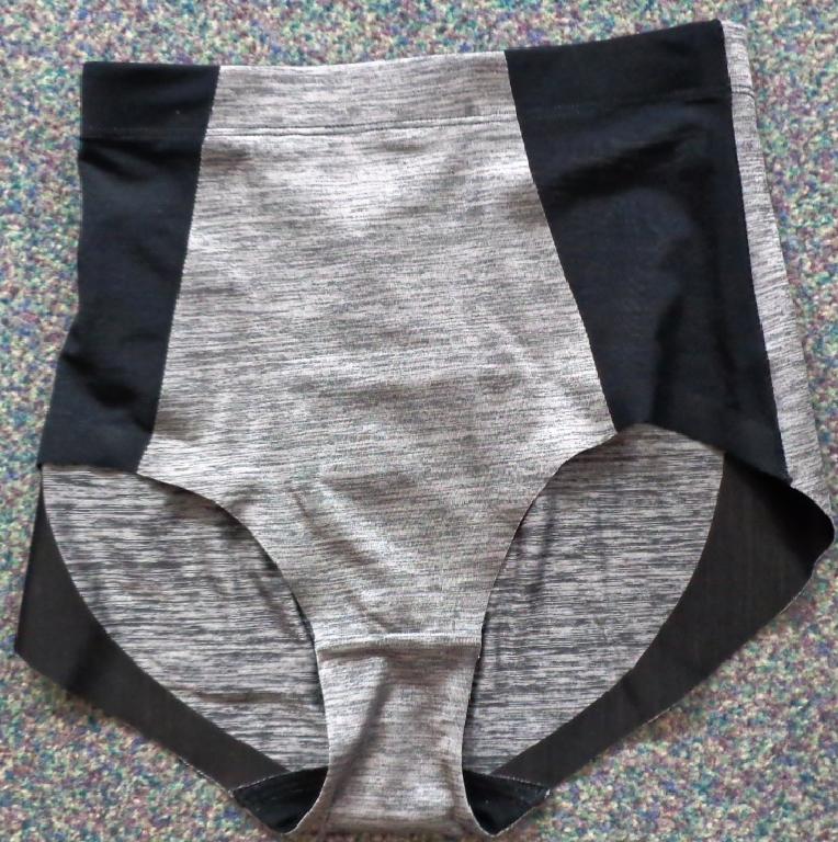 A TUMMY CONTROL HIGH LEG KNICKER, INTENDED TO FLATTEN THE STOMACH. MADE OF POLYAMIDE AND ELASTANE. GREY IN COLOUR WITH TWO BLACK STRIPS TO THE SIDES.