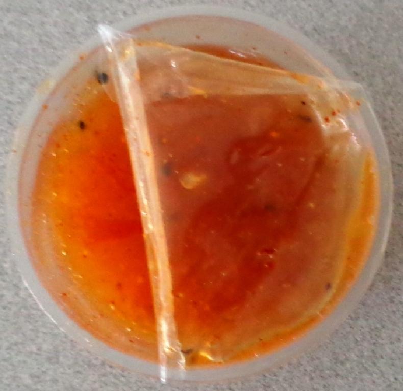 MANGO SAUCE CONTAINING WATER, SUGAR, MANGO PUREE, CHILLI, PINEAPPLE, MODIFIED STARCH, TAMARIND, GINGER, SALT, ACETIC ACID AND XANTHAN GUM. IT IS COMPLETELY HOMOGENISED WITH NO LUMPS OF FRUIT IN IT. IN A PLASTIC TUB CONTAINING 50 GRAMMES OF THE PRODUCT.