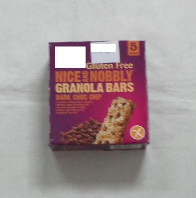 A GRANOLA BAR CONTAINING: GRANOLA (GLUTEN FREE ROLLED OATS, RAW CANE SUGAR, SUNFLOWER OIL, ROLLED AMARANTH, ROLLED QUINOA) TAPIOCA SYRUP, CHOCOLATE CHIPS, (RAW CANE SUGAR UNSWEETENED CHOCOLATE (CONTAINS MILK), COCOA BUTTER, SOY LECITHIN), BROWN RICE FLOUR, BROWN RICE SYRUP, ACACIA GUM, SUNFLOWER OIL, RAW CANE SUGAR, SEA SALT, NATURAL FLAVOUR, MOLASSES, CULTURED DRIED SKIMMED MILK. 5 INDIVIDUALLY WRAPPED 35G BARS IN PLASTIC WRAPPERS. PACKAGED IN A PRINTED CARDBOARD BOX.