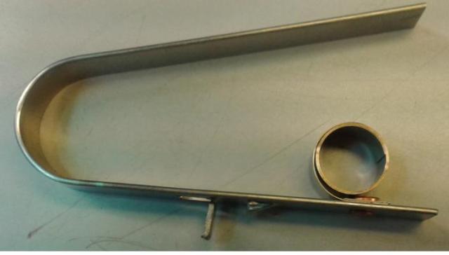 CONSTANT FORCE SPRING. USED TO HOLD IN A CARBON BRUSH IN ELECTRIC MOTORS. MADE OF STEEL. CONSIDERED TO BE A PART OF GENERAL USE.