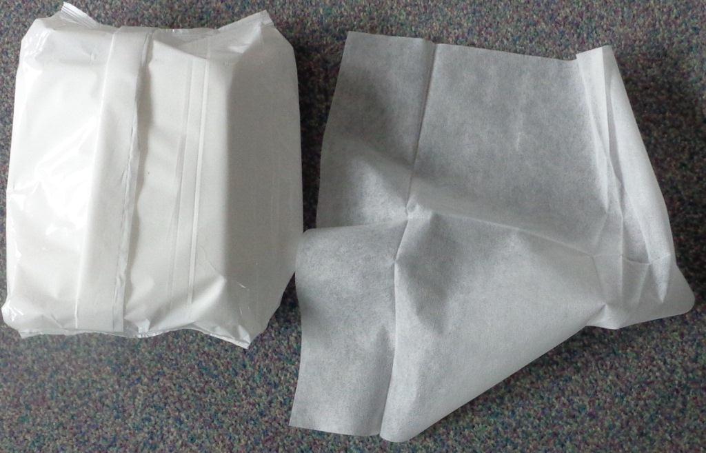DRY PATIENT WIPES .

THE WIPES ARE FOR USE IN CONJUCTION WITH SOAP AND WATER OR EMOLLIENT CREAMS FOR SKIN WIPING OF PATIENTS  AND ELDERLY PEOPLE IN HOSPITALS, DAY CARE CENTRES, NURSING HOMES AND DOMESTIC CARE ENVIRONMENTS.

THE WIPES ARE EITHER MADE OF 100% POLYPROPYLENE NONWOVEN FABRIC OR 85% POLYPROPYLENE WITH 15% VISCOSE NON WOVEN FABRIC.

THE WEIGHT OF THE FABRIC IS  MORE THAN  25 GRAMS PER SQUARE METRE BUT NOT MORE THAN 70 GRAMS PER SQUARE METRE (TYPICALLY BETWEEN 25 G/M2 AND 45 G/M2).

THE WIPES ARE PRODUCED BY  LYING DOWN CARDED FIBRES ON A BELT AND THEN FORMING INTO A  CONTINUOUS WEB BY USING HEAT AND PRESSURE TO BOND THE FIBRES. THE WIDE WIDTH MOTHER ROLLS ARE THEN SLIT INTO COILS OF FABRIC WHICH ARE THEN CONVERTED THROUGH FOLDING AND CUTTING MACHINES INTO INDIVIDUAL WIPES  (PIECES).

50 OR 100 INDIVIDUAL WIPES ARE THEN  PACKAGED IN PLASTIC DISPENSER BAGS.. THE  WIPES  ARE  RECTANGULAR OR SQUARE IN SHAPE, TYPICAL SIZE APPROXIMATELY 28 CMS X 32 CMS, QUARTER FOLDED.  TYPICALLY 20 PACKS ARE THEN BOXED IN A CORRUGATED CARDBOARD CASE.