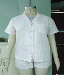 LADIES  WOVEN PYJAMAS. SHIRT AND SHORTS. 100% COTTON. CONSISTING OF AN UPPER GARMENT. REACHING DOWN TO THE WAIST. WITH COLLAR  AND RIGHT OVER LEFT OPENING. WITH BREAST POCKET ON THE LEFT HAND SIDE. WITH MATCHING COTTON SHORTS.  ELASTICATED AT WAIST.