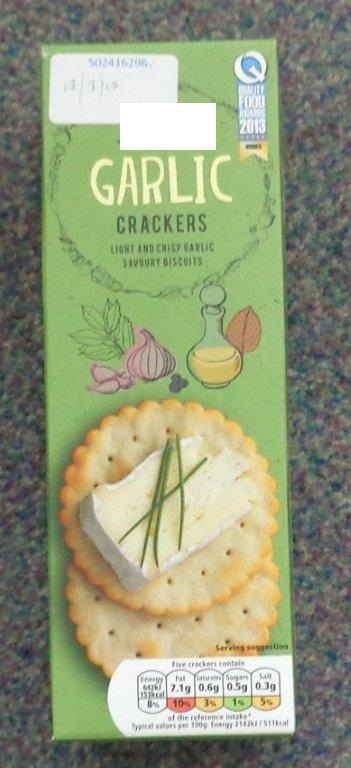 A 200G PACK OF GARLIC CRACKERS. SAVOURY BISCUITS. INGREDIENTS; WHEAT FLOUR (WHEAT FLOUR, NIACIN, IRON, THIAMIN, RIBOFLAVIN, FOLIC ACID), SUNFLOWER OIL, GARLIC POWDER, WHEY POWDER (MILK), CORN STARCH, SALT, SUGAR, CANE SUGAR SYRUP, YEAST. PACKED IN A PLASTIC INNER SLEEVE WITHIN A PRINTED CARDBOARD BOX.