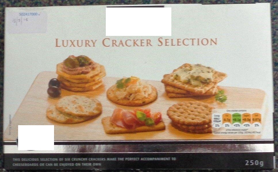 A 250G PACK OF CHEESEBOARD BISCUITS. INGREDIENTS; WHEAT CRACKERS: WHEAT FLOUR (WHEAT FLOUR, NIACIN, IRON, THIAMIN, RIBOFLAVIN, FOLIC ACID), SUNFLOWER OIL, DEFATTED WHEAT GERM, SUGAR, WHEY POWDER (MILK), SALT, RAISING AGENTS: AMMONIUM CARBONATES, SODIUM CARBONATES; WHEAT BRAN, AUTOLYSED YEAST, HYDROLYZED WHEAT PROTEIN. SEA SALT AND BLACK PEPPER SCALLOPED CRACKER: WHEAT FLOUR (WHEAT FLOUR, NIACIN, IRON, THIAMIN, RIBOFLAVIN, FOLIC ACID), SUNFLOWER OIL, YEAST AUTOLYSATE, CORN STARCH, BLACK PEPPER, SEA SALT, SALT, SUGAR, WHEY POWDER (MILK), SUGAR CANE SYRUP, FLAVOURING, YEAST. ROSEMARY SCALLOPED CRACKER: WHEAT FLOUR (WHEAT FLOUR, NIACIN, IRON, THIAMIN, RIBOFLAVIN, FOLIC ACID), SUNFLOWER OIL, ROSEMARY SEASONING (DEXTROSE, MALTODEXTRIN, SPICE (ROSEMARY, BLACK PEPPER), ONION POWDER, GARLIC POWDER, SUGAR, DEHYDRATED GARLIC, SUNFLOWER OIL, FLAVOURING), SALT, CORN STARCH, SUGAR, YEAST AUTOLYSATE, SUGAR CANE SYRUP, FLAVOURING, YEAST. GARLIC SCALLOPED CRACKER: WHEAT FLOUR (WHEAT FLOUR, NIACIN, IRON, THIAMIN, RIBOFLAVIN, FOLIC ACID), SUNFLOWER OIL, GARLIC POWDER, WHEY POWDER (MILK), CORN STARCH, SALT, SUGAR, SUGAR CANE SYRUP, YEAST. ORIGINAL WATER CRACKER: WHEAT FLOUR (WHEAT FLOUR, NIACIN, IRON, THIAMIN, RIBOFLAVIN, FOLIC ACID), SUNFLOWER OIL, SALT SUGAR. PACKED IN A PLASTIC INNER SLEEVE WITHIN A PRINTED CARDBOARD BOX.