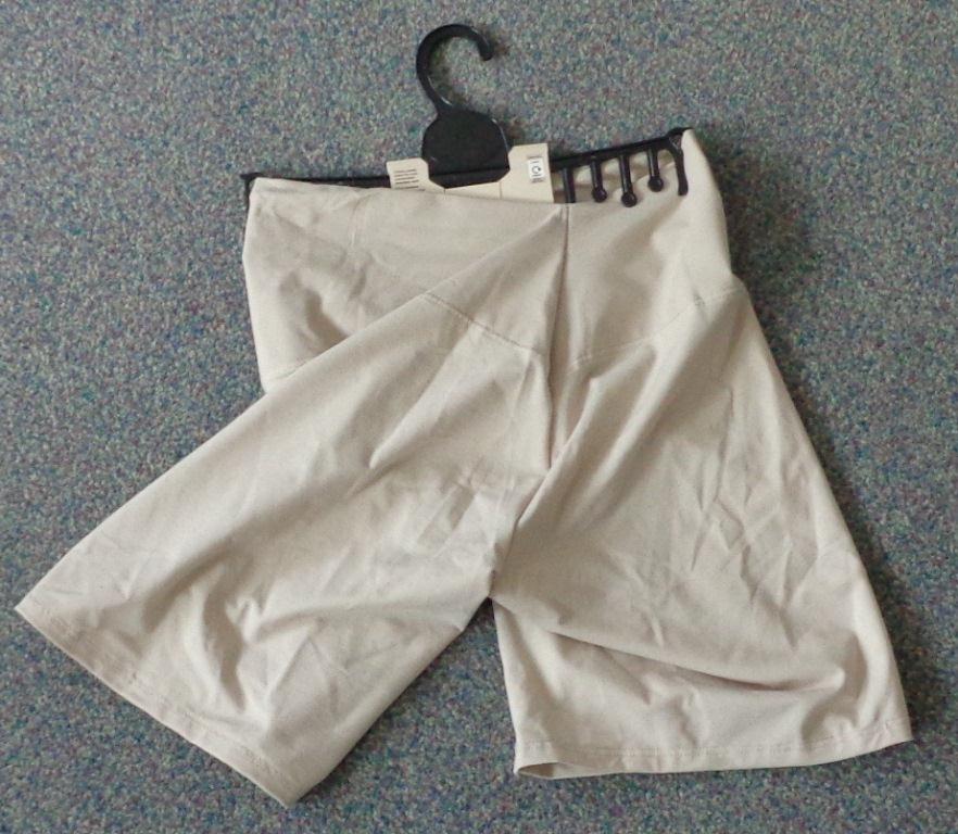 KNITTED LADIES PANTY GIRDLE.  GARMENT IS DESIGNED TO FLATTEN THE STOMACH AS WELL AS THE HIPS AND THIGHS.
THE GARMENT CONSISTS OF A DOUBLE BANDED FABRIC  THAT EXTENDS AROUND THE LOWER STOMACH AND WAIST . THIS BAND  MEASURES APPROXIMATELY 11 CMS AT THE SIDES. THE GARMENT THEN EXTENDS FROM THIS BAND  APPROXIMATELY 25 CMS  DOWN EACH LEG. THE BOTTOM OF EACH LEG IS HEMMED.

COMPOSITION 45% ELASTANE, 31% MODAL AND 24% COTTON.

PRODUCT IS PRESENTED FOR RETAIL SALE ON PLASTIC HANGER WITH PRINTED CARD.
