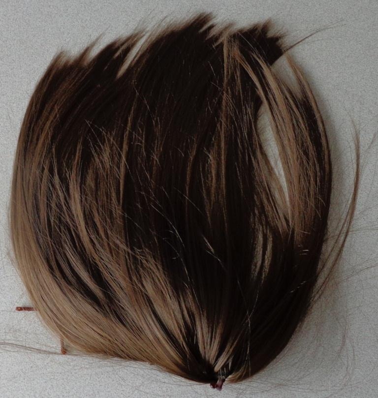 FAUX FUR PONYTAIL MADE OF PETP (POLYETHYLENE TEREPHTHALATE POLYESTER). DESIGNED TO BE CLIPPED INTO A WEARERS EXISTING PONYTAIL IN ORDER TO CREATE A FULLER, LONGER PONYTAIL. SUPPLIED WITH A HARD PLASTIC CLAW CLIP FOR ATTACHMENT PURPOSES. AVAILABLE IN 3 SHADES TO MATCH THE WEARERS OWN HAIR. PACKED IN A RE-SEALABLE POLYTHENE BAG.