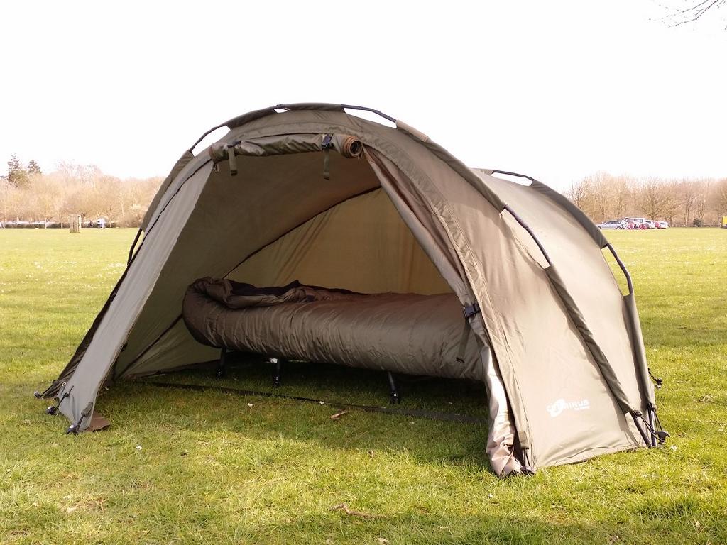 A POLYESTER TENT INTENDED PRIMARILY FOR DAY USE AS A SHELTER WHEN FISHING. IT IS HELD UP BY FLEXIBLE ALUMINIUM POLES. IT HAS ROLL UP DOOR WITH A WINDOW, AND COMES WITH A GROUNDSHEET.