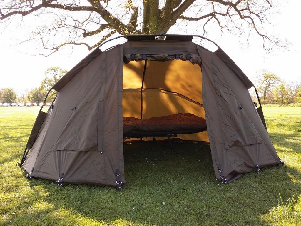 A POLYESTER TENT INTENDED PRIMARILY FOR DAY USE AS A SHELTER WHEN FISHING.  IT IS HELD UP BY FLEXIBLE ALUMINIUM POLES. IT HAS ROLL UP DOOR WITH A WINDOW, AND COMES WITH A GROUNDSHEET.