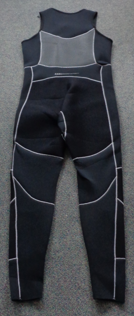 ARTICLE IS AN ALL IN ONE MENS GARMENT MADE FROM A CELLULAR RUBBER FABRIC COVERED ON BOTH SIDES WITH A NYLON TEXTILE. THE GARMENT COVERS THE LEG, TORSO AND CHEST WITH A ROUND NECK. IT DOES NOT HAVE SLEEVES. THE GARMENT REACHES UP UNDER THE ARMPITS AND OVER THE SHOULDERS. DOES NOT COVER THE SIDES OF THE SHOULDERS. BLACK AND DARK GREY IN COLOUR WITH CONTRAST STITCHING. THE GARMENT USES ZONED NEOPRENE TEHCNOLOGY WITH HIGH LOFT NEOPRENE TO PROTECT THE TORSO. X4 SUPERFLEX FABRIC ACROSS THE SHOULDERS, UNDERARMS AND BEHIND THE KNEES FOR COMPLETE FREEDOM OF MOVEMENT. ABRASION RESISTANT DI-GUARD SEAT AND KNEES. GLUED AND BINDSTITCHED CONSTRUCTION FOR A WATERPROOF SEAL, SUPERFLEX NECK OPENING ELIMINATES THE NEED FOR A ZIPPER. LOW PROFILE SEAL WITH A SILICON GRIP PRINT WITH EMBOSSED KNEE PROTECTION. INCLUDES A RELIEF ZIPPER.