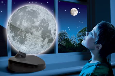 A 22.8 CM MOON GLOBE WITH DETAILED GEOGRAPHICAL FEATURES OF THE EARTHS MOON. THE GLOBE ILLUMINATES IN THE DARK TO BECOME A ROOM DECORATION AND IS PACKAGED IN A CARDBOARD BOX.