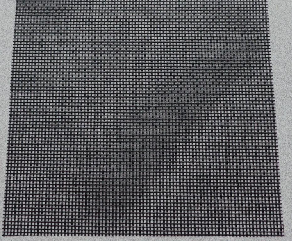 A ROLL OF WOVEN POLESTER MESH WITH A PVC COATING, NOT VISIBLE TO THE NAKED EYE. USED IN THE MANUFACTURE OF TAILOR MADE PROTECTIVE WIND SHIELDS FOR AIR COOLED CONDENSERS AND AIR COOLERS IN THE POWER INDUSTRY AS WELL AS THE OIL RIG AND OFFSHORE INDUSTRY