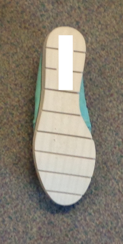 A SLIP-ON SHOE FOR WOMEN. NOT COVERING THE ANKLE. TURQUOISE COLOUR LEATHER UPPER WITH PERFORATED VAMP. WHITE PLASTIC SOLE WITH HORIZONTAL GROOVED TREAD. BRAND LOGO ON INSOLE AND SOLE.INSOLE LENGTH OF 24CM. HEEL HEIGHT APPROXIMATELY 2CM. PADDED INSOLE