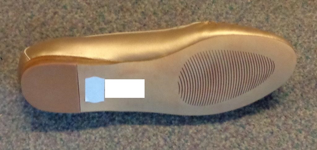 A SLIP-ON SHOE FOR WOMEN. NOT COVERING THE ANKLE. GOLD COLOUR LEATHER UPPER WITH STITCHED VAMP. BEIGE LEATHER SOLE WITH PRINTED TREAD PATTERN ON THE SMOOTH SURFACE. BRAND LOGO ON INSOLE AND SOLE. INSOLE LENGTH OF 24CM. HEEL HEIGHT APPROXIMATELY 1CM.
