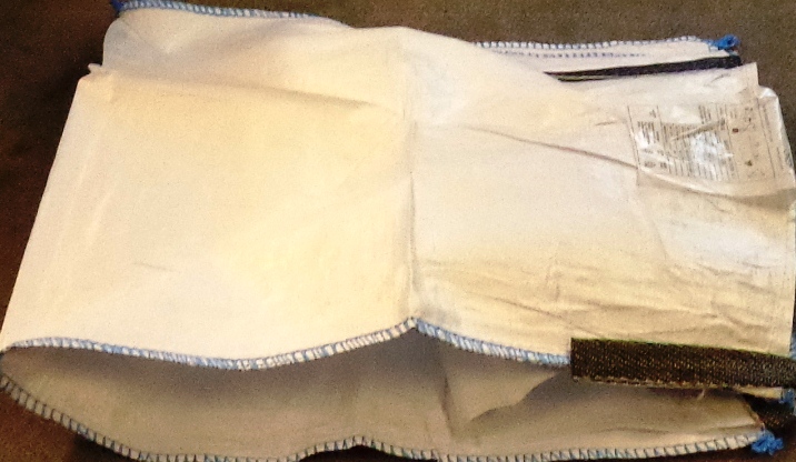 FLEXIBLE INTERMEDIATE BULK CONTAINER IN THE FORM OF A LARGE POLYPROPYLENE SACK. CONSTRUCTION OF SACK IS FROM WOVEN POLYPROPYLENE TAPES OF A WIDTH OF LESS THAN 5MM. SEAMS SEWN WITH POLYPROPYLENE YARN. FEATURES 4 LIFTING LOOPS SEWN AT EACH CORNER. SUPPLIED EMPTY TO ENABLE USER TO FILL WITH A VARIETY OF PRODUCTS. PACKAGED IN A ZIPPED BAG BEARING BRAND NAME WITH CARRYING HANDLES.