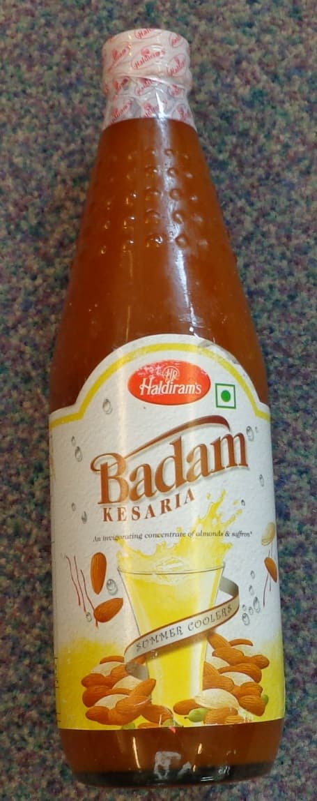 BADAM KESARIA, A FLAVOURED SUGAR SYRUP. NOT READY TO DRINK. ADD WATER TO MAKE A BEVERAGE. CONTAINS LESS THAN 70% SUCROSE.

INGREDIENTS: SUGAR, WATER, ALMOND, ROSE WATER, CARDAMOM, ACID 330 , SAFFRON, PRESERVATIVE E211, COLOUR E102 & E133, INVERT SUGAR.