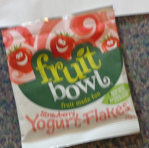 FORMED FRUIT PIECES MADE BY CONCENTRATING FRUIT PUREES AND JUICES, WHICH ARE THEN ENROBED IN A YOGURT FLAVOURED COATING WHICH IS APPLIED BY PANNING. FRUIT PIECES 40%. YOGURT COATING 60%. YOGURT CONTAINS SUGAR. PACKAGED IN 25G BAGS.