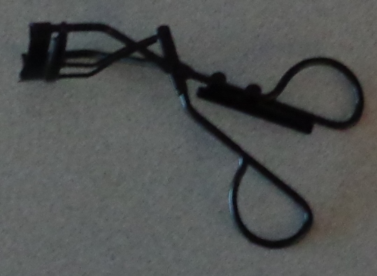 METAL EYELASH CURLERS. A HAND OPERATED TOOL. PUT UP FOR RETAIL SALE IN A PLASTIC BAG.