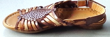 LADIES FOOTWEAR NOT COVERING THE ANKLE. A SANDAL WITH UPPERS OF LEATHER CONSISTING OF A VAMP OF MULTIPLE STRAPS WITH A DECORATIVE CENTRE PIECE. OPEN AT THE TOE. SLING BACK HEEL STRAP WITH VELCRO FASTENING. OUTER SOLE OF RUBBER. INSOLE LEGTH OF LESS THAN 24CM. COMBINED HEEL AND SOLE WITH A HEEL HEIGHT LESS THAN 3CM. COLOUR: TAN AND DARK BROWN STRAPS, TAN COLOUR INSOLE BEARING BRAND LOGO AND PRINTED PATTERN WITH STITCHING ROUND THE EDGE.
