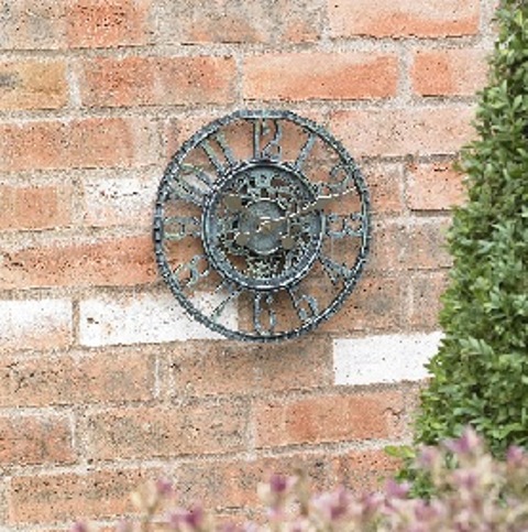 A WALL CLOCK MADE OF RESIN WITH A BLUE EFFECT FINISH.  THE CLOCK HAS ROUND SHAPED FACE OF A 12 INCH DIAMETER. THE TIME IS INDICATED USING HANDS AND ROMAN NUMERALS.  IT IS BATTERY OPERATED (REQUIRING 1 X AA BATTERY).  THE CLOCK IS PACKAGED IN A COLOUR PRINTED CARDBOARD BOX.