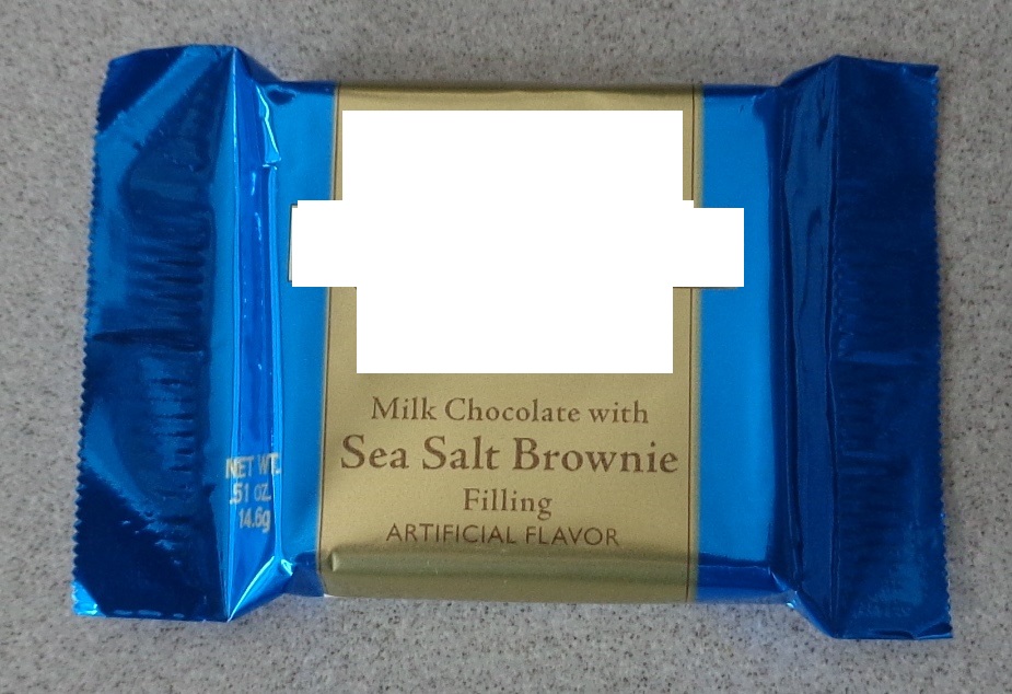 A 14.6G MILK CHOCOLATE SQUARE WITH A SEA SALT CHOCOLATE BROWNIE FLAVOUR FILLING. INDIVIDUALLY WRAPPED IN A PRINTED BLUE AND GOLD COLOURED SEALED WRAPPER.