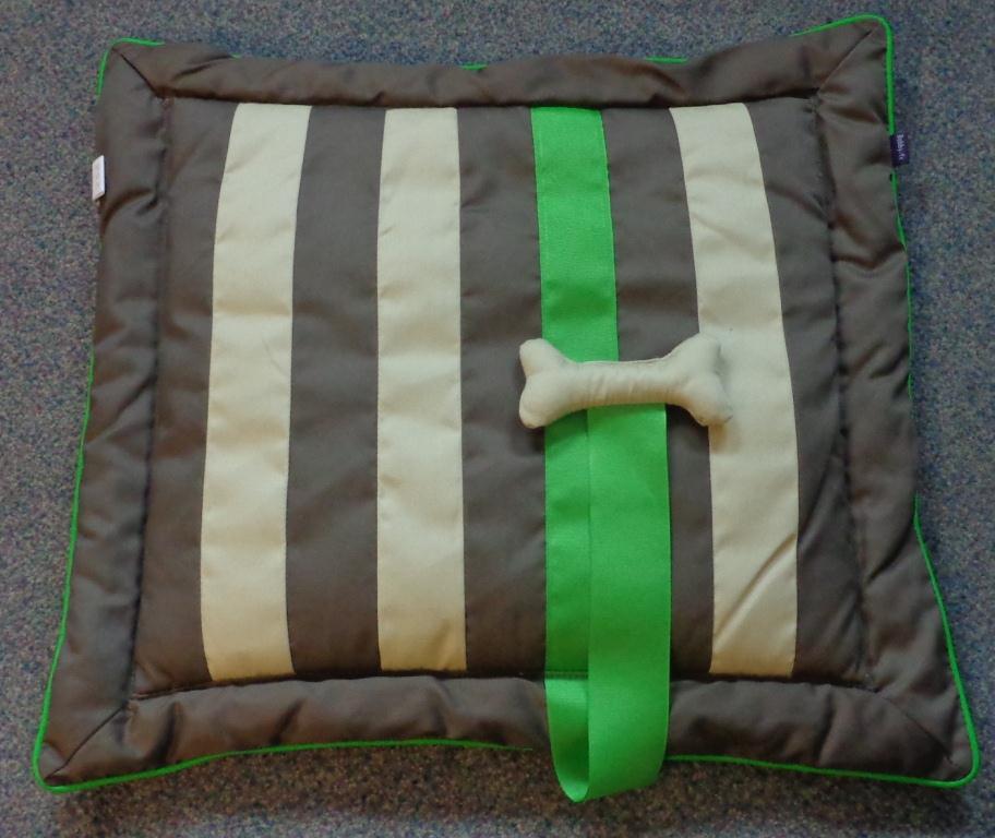 A RECTANGULAR DOG BED/MATTRESS MEASURING 60 X 50CM, MADE OF WOVEN FABRIC, PADDEDN, WITH A SMALL FABRIC BONE ATTACHED BY A FABRIC STRAP. SOLID BROWN ON ONE SIDE, BROWN/GREEN/BEIGE STRIPES ON REVERSE.
