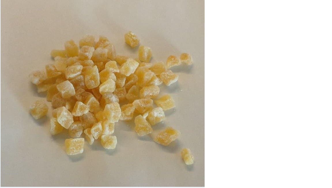 CRYSTALLIZED GINGER SMALL DICE.. FRESH GINGER IS TAKEN, CLEANED AND CUT. IT IS BOILED IN SUGAR SYRUP FOR SEVERAL DAYS AND THUS PRESERVED, DRAINED OF ITS SYRUP. THIS DRAINED GINGER IS ROLLED IN GRANULATED SUGAR AND IS NOW TERMED CRYSTALLIZED GINGER