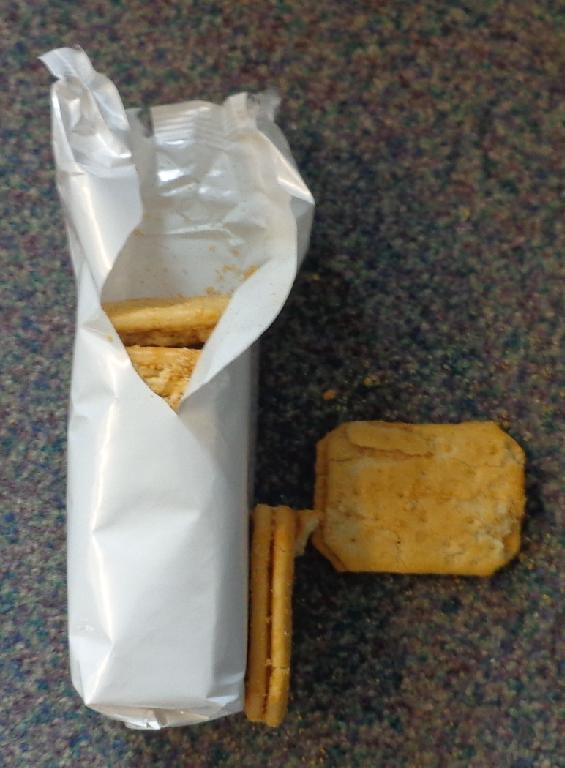 A SANDWICH BISCUIT OF CHEESE FLAVOURED CREAM BETWEEN TWO LIGHT YELLOW SALTY BISCUITS. HAS A SALT/CHEESE FLAVOUR; NOT SWEET. PUT UP FOR RETAIL SALE IN 48 GRAMME AND 150 GRAMME PACKS.