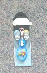 A 95% ZINC CLIP WITH A 5% STEEL TRIANGULAR CONNECTOR. THE PRODUCT IS DESIGNED TO BE CLIPPED TO A ZIPPER OF A BAG OR A GARMENT. IT HAS A PLASTIC FOB ATTACHED WITH A BUTTON ON IT THAT ACTIVATES A LED LIGHT. THE LIGHT HAS TWO SETTINGS, EITHER A CONTINUOUS BACK LIGHT OR A FLASHING LIGHT WHICH ILLUMINATES A PERSONALISED NAME OVERLAID IN SILICON.